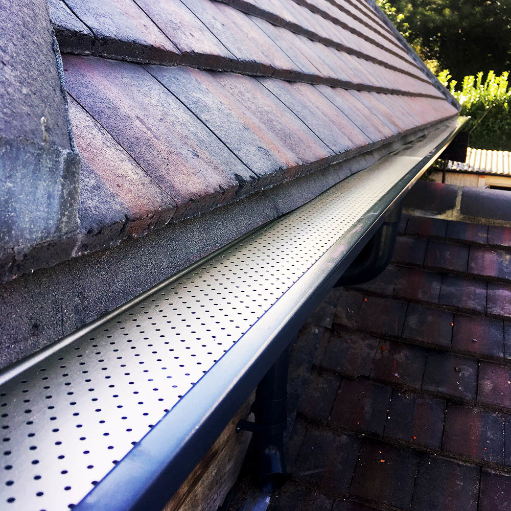 Close up of Mustang seamless gutter with leaf-guard installed.