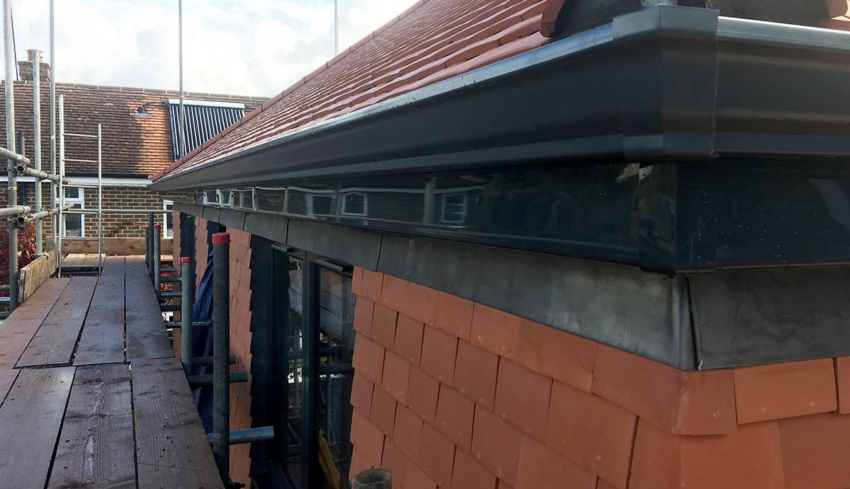 Commercial property with black seamless aluminium guttering. Durable and low-maintenance.